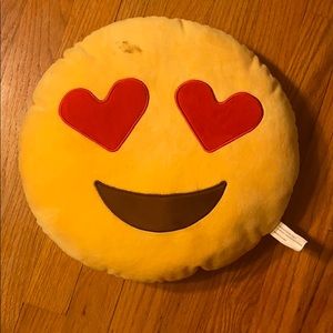 a yellow heart eyes pillow